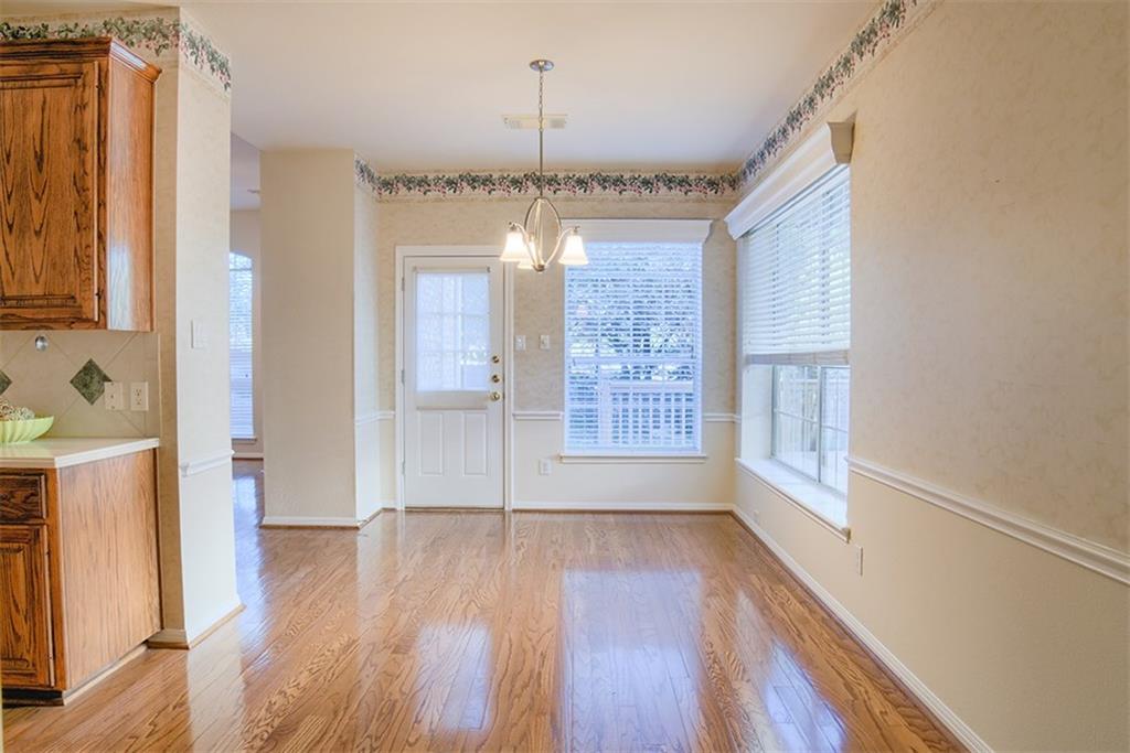 3404 Oxsheer Drive Austin, TX 78732 - Photo 11 of 15 a view of an empty room with wooden floor and a window