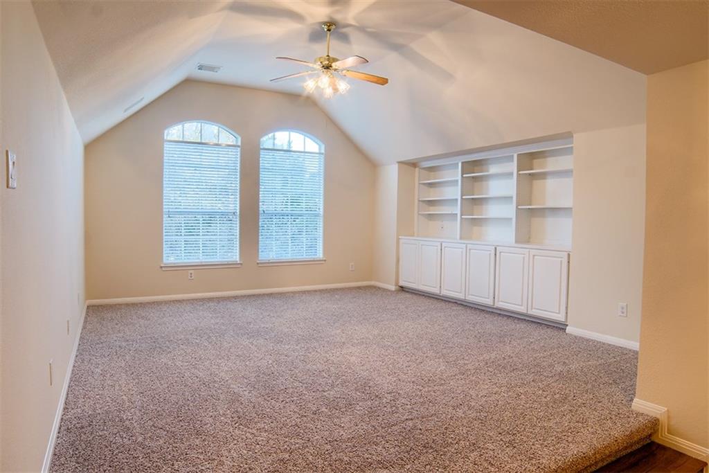 3404 Oxsheer Drive Austin, TX 78732 - Photo 13 of 15 an empty room with windows and cabinet