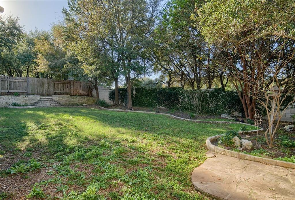 3404 Oxsheer Drive Austin, TX 78732 - Photo 15 of 15 a view of a backyard with a small cabin