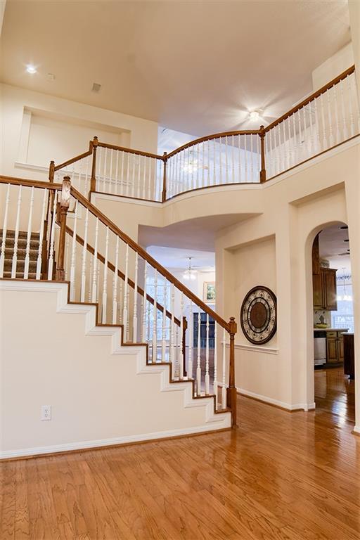 3404 Oxsheer Drive Austin, TX 78732 - Photo 3 of 15 a view of a hallway with entryway wooden floor and front door