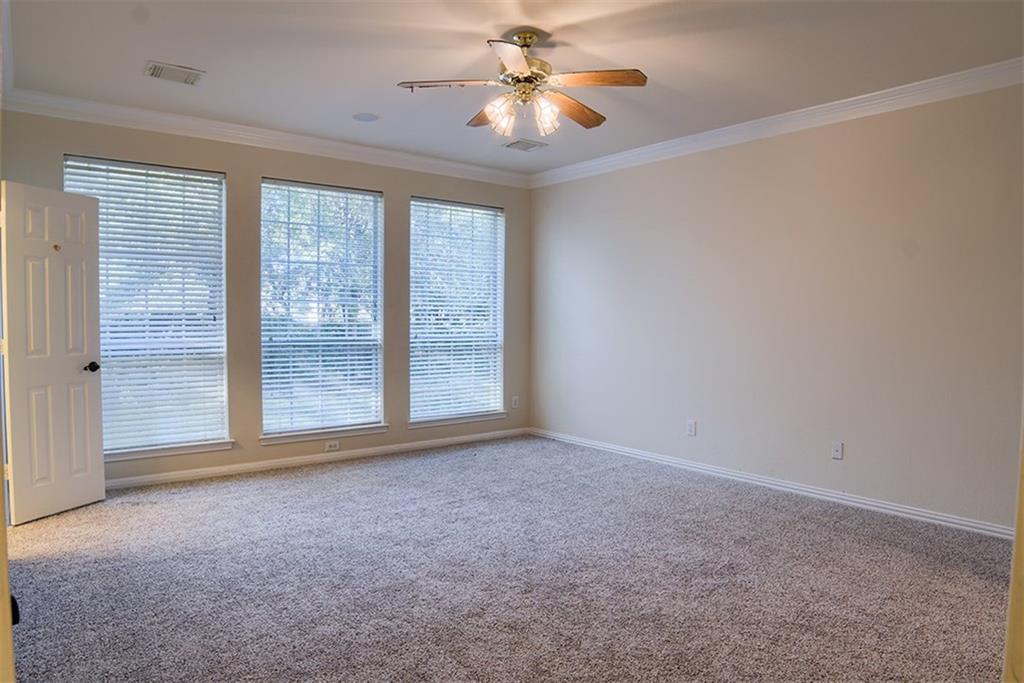 3404 Oxsheer Drive Austin, TX 78732 - Photo 6 of 15 a view of empty room with window and a ceiling fan