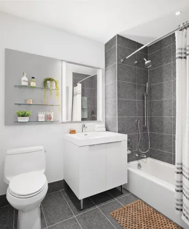 a bathroom with a sink a toilet and bathtub