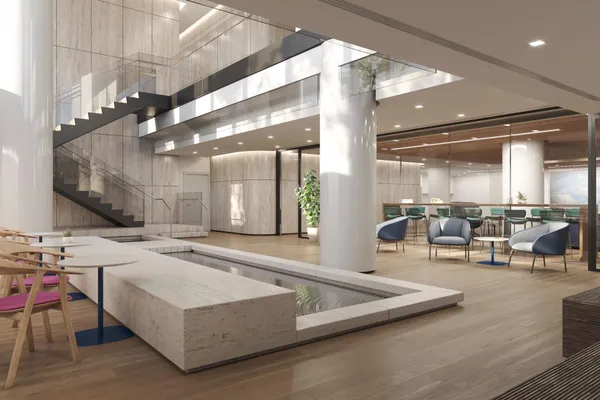 a lobby with furniture and a large mirror