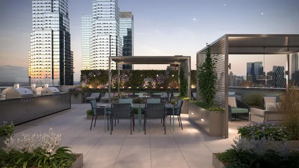 a outdoor space with lots of tables a garden and chairs