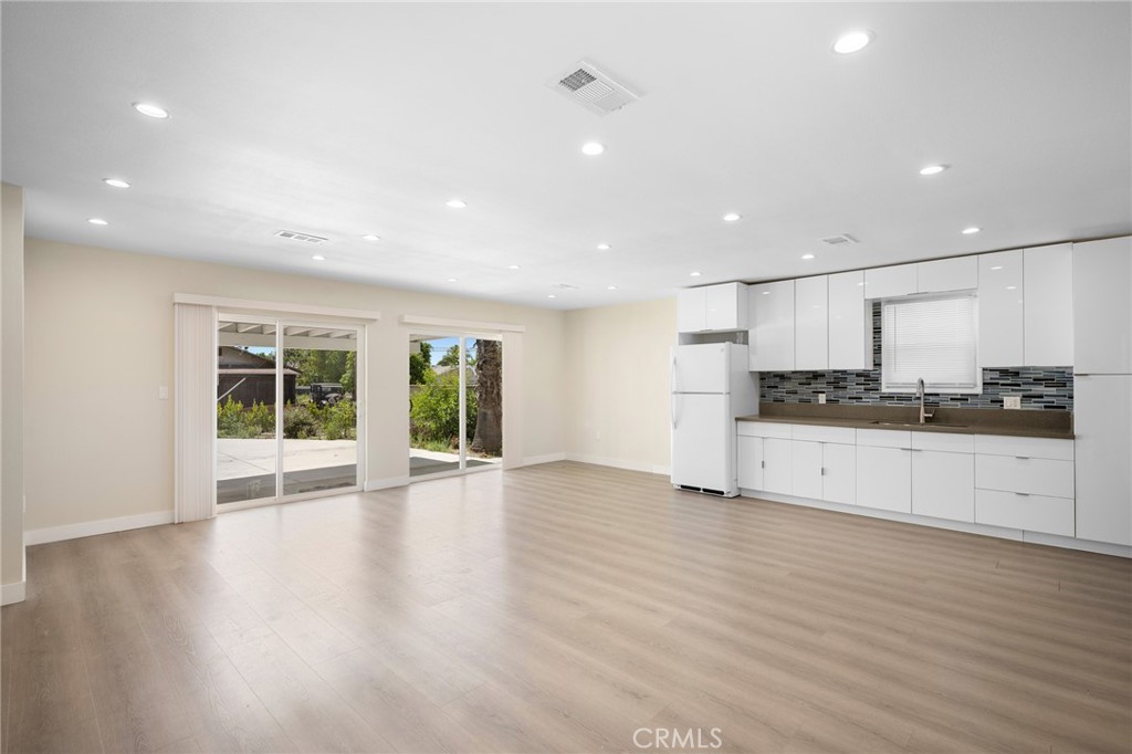 8435 Rincon Avenue Sun Valley, CA 91352 - Photo 4 of 61 a view of a kitchen with stainless steel appliances granite countertop a stove and a wooden floors
