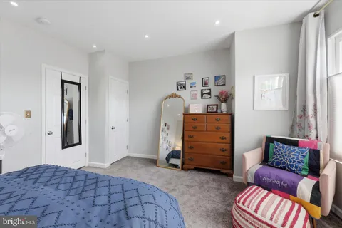 a bedroom with a bed and furniture