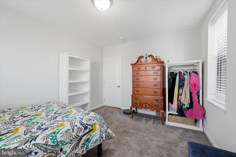 a bedroom with a bed and a closet