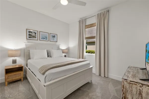 a bed room with a bed and a window