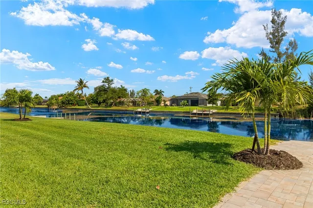 a view of a swimming pool with an outdoor space and seating area