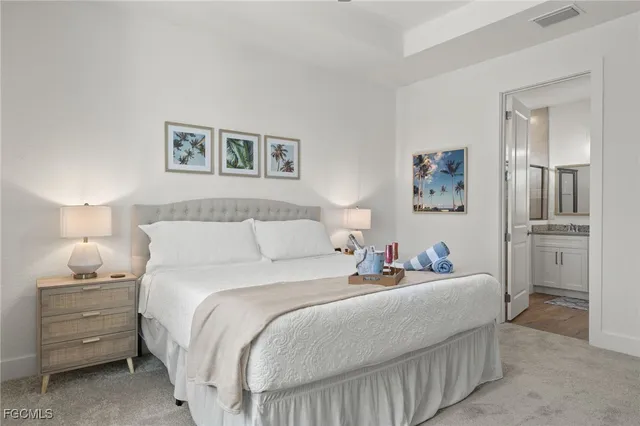 a bedroom with a bed and a night stand