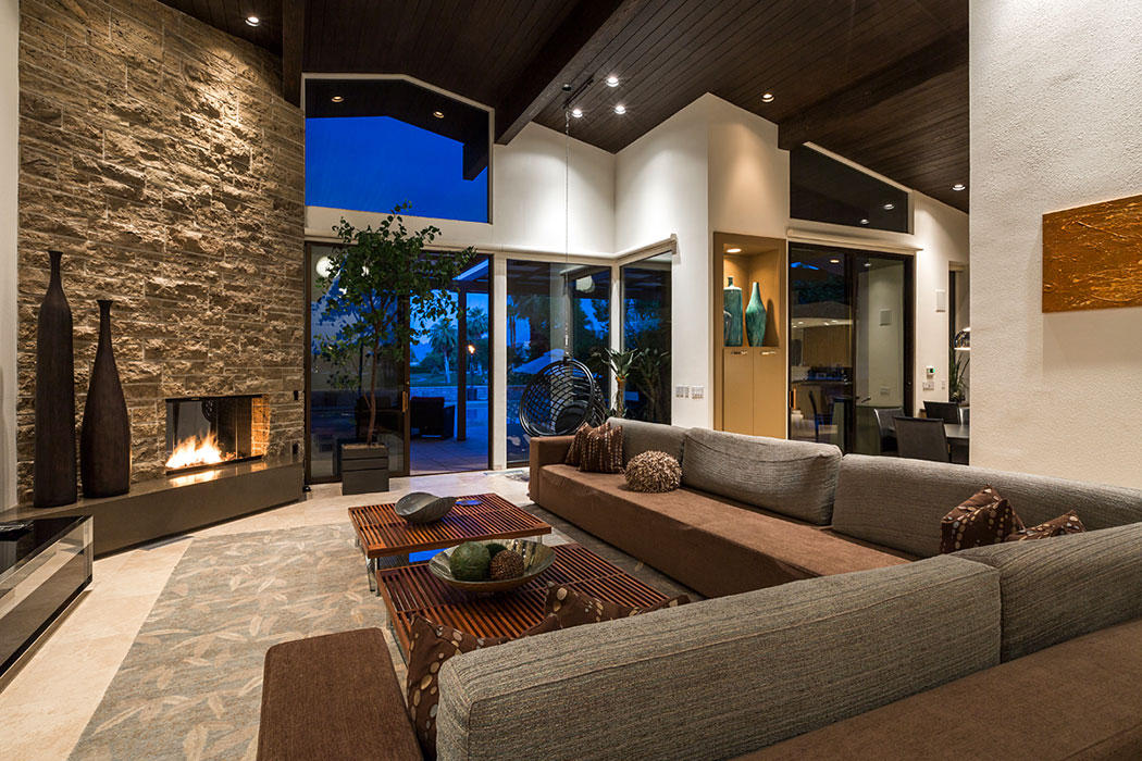 12 Avenida Andra Palm Desert, CA 92260 - Photo 17 of 42 a living room with furniture and a fireplace