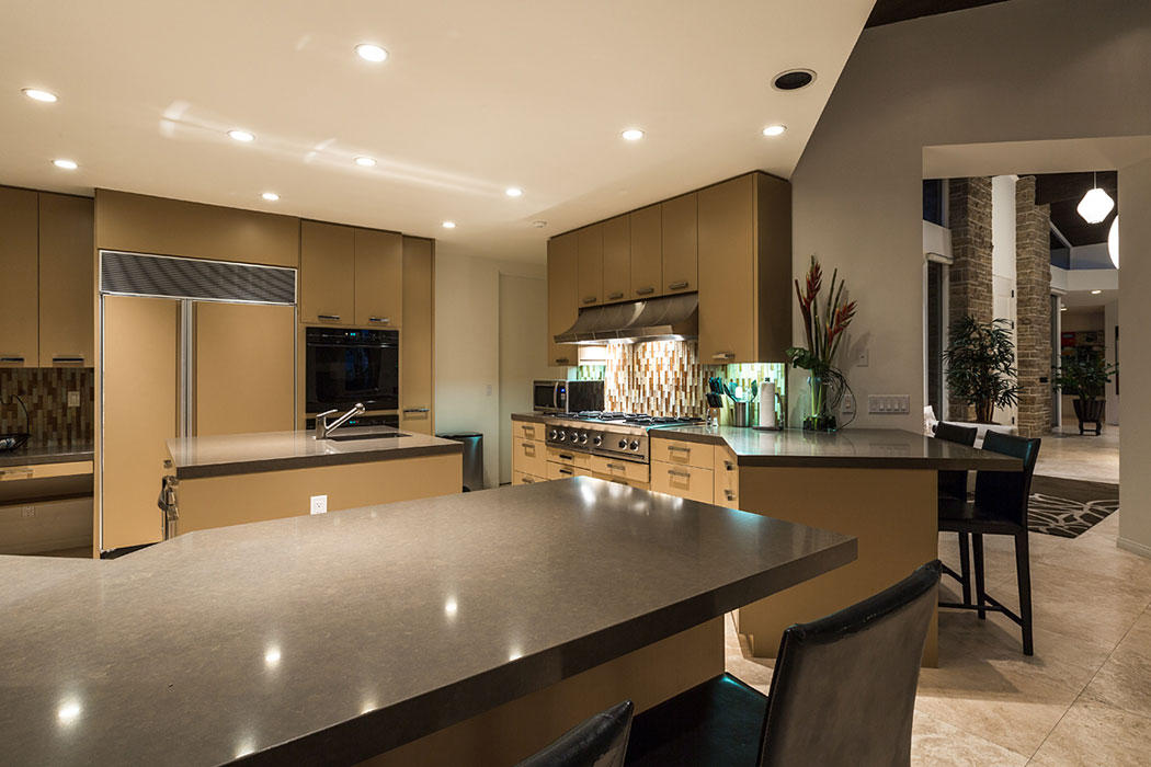 12 Avenida Andra Palm Desert, CA 92260 - Photo 23 of 42 a kitchen with counter top space cabinets and stainless steel appliances