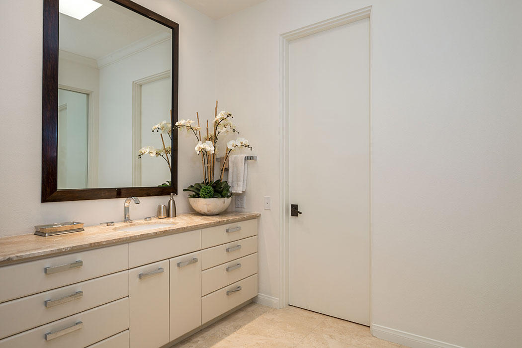 12 Avenida Andra Palm Desert, CA 92260 - Photo 31 of 42 a bathroom with a double vanity sink and mirror