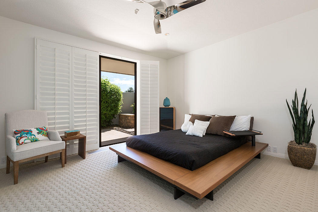 12 Avenida Andra Palm Desert, CA 92260 - Photo 33 of 42 a living room with furniture and a potted plant