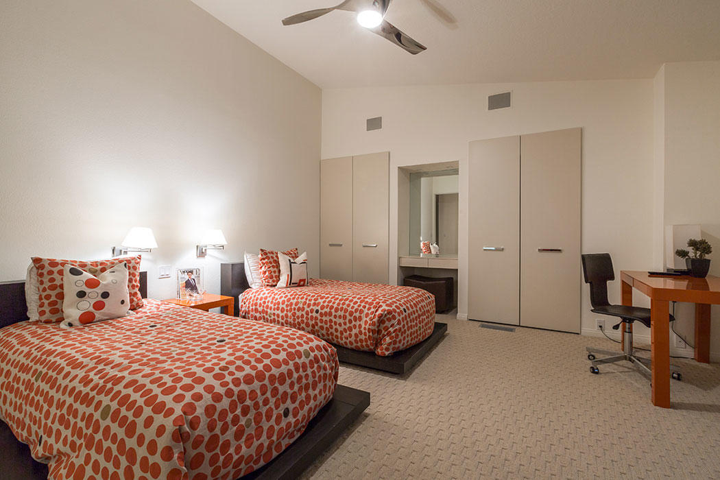 12 Avenida Andra Palm Desert, CA 92260 - Photo 42 of 42 a bedroom with two beds and a chandelier