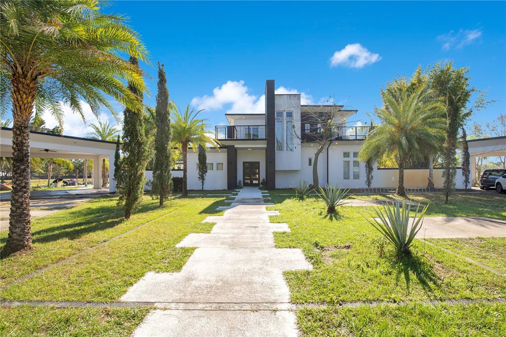 34500 Tree Frog Lane Eustis, FL 32736 - Photo 1 of 1 a swimming pool with outdoor seating and yard