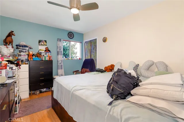 a bed room with a bed and a chandelier