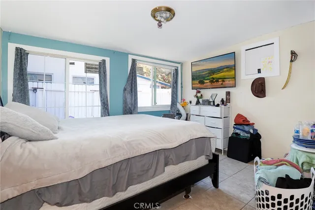 a bedroom with a bed and cabinets