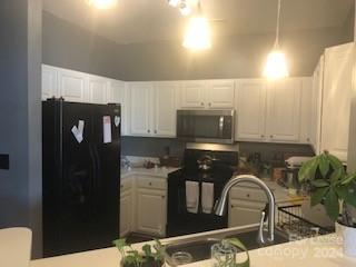 1328 Torrence Circle Davidson, NC 28036 - Photo 12 of 34 a kitchen with a refrigerator and a stove