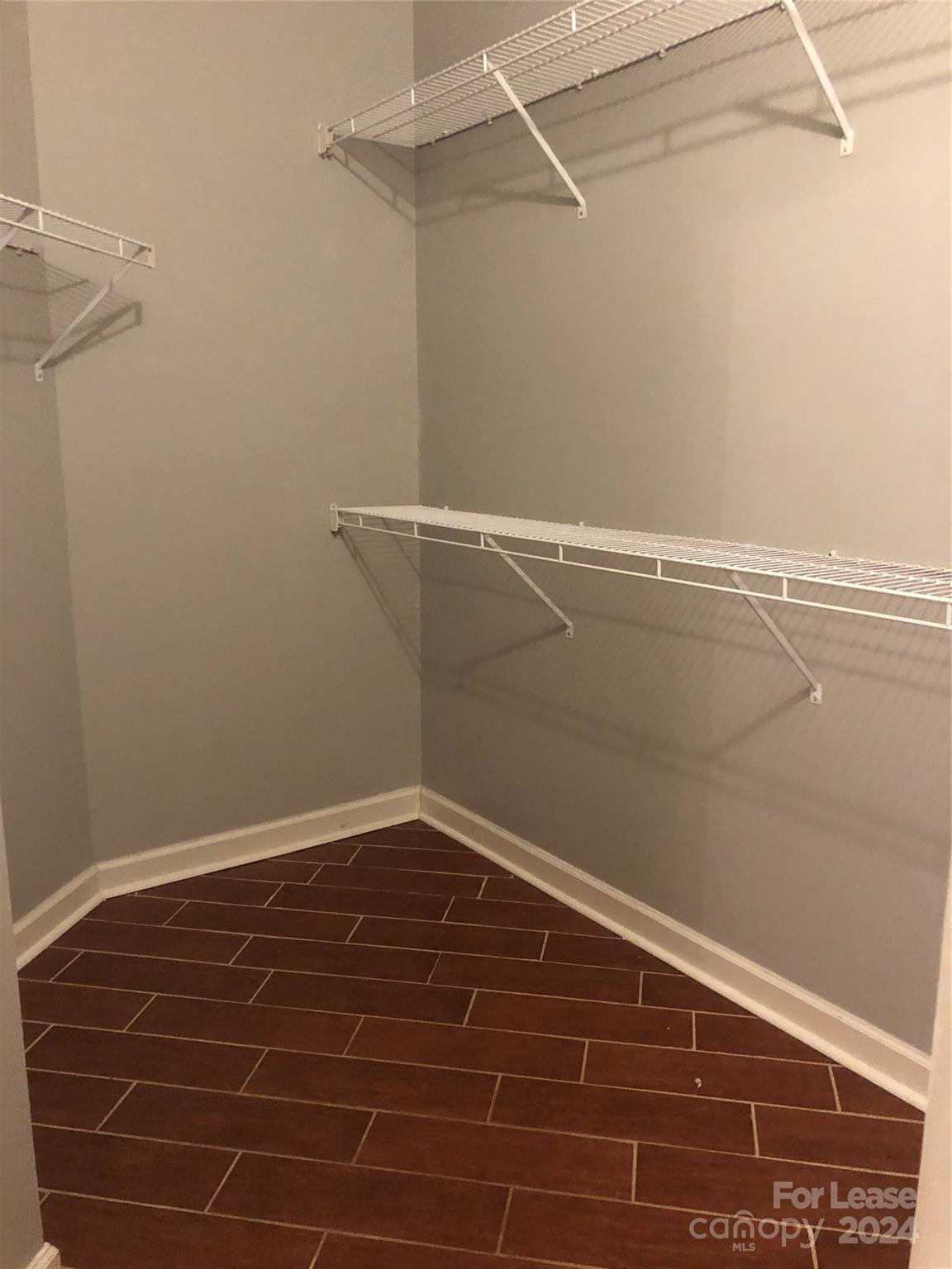 1328 Torrence Circle Davidson, NC 28036 - Photo 16 of 34 a view of a room with racks on the wall