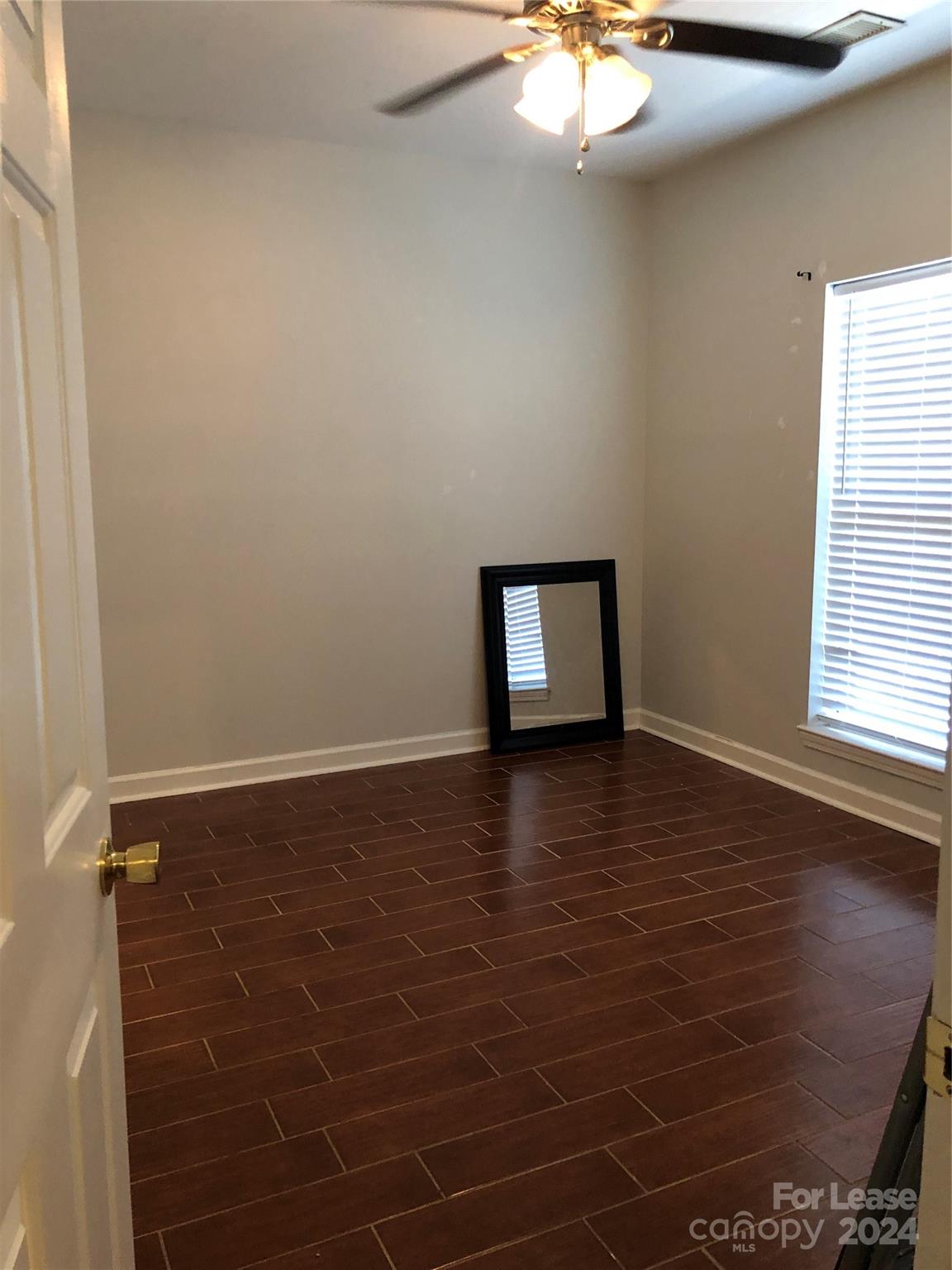 1328 Torrence Circle Davidson, NC 28036 - Photo 17 of 34 a view of a room with wooden floor and a window