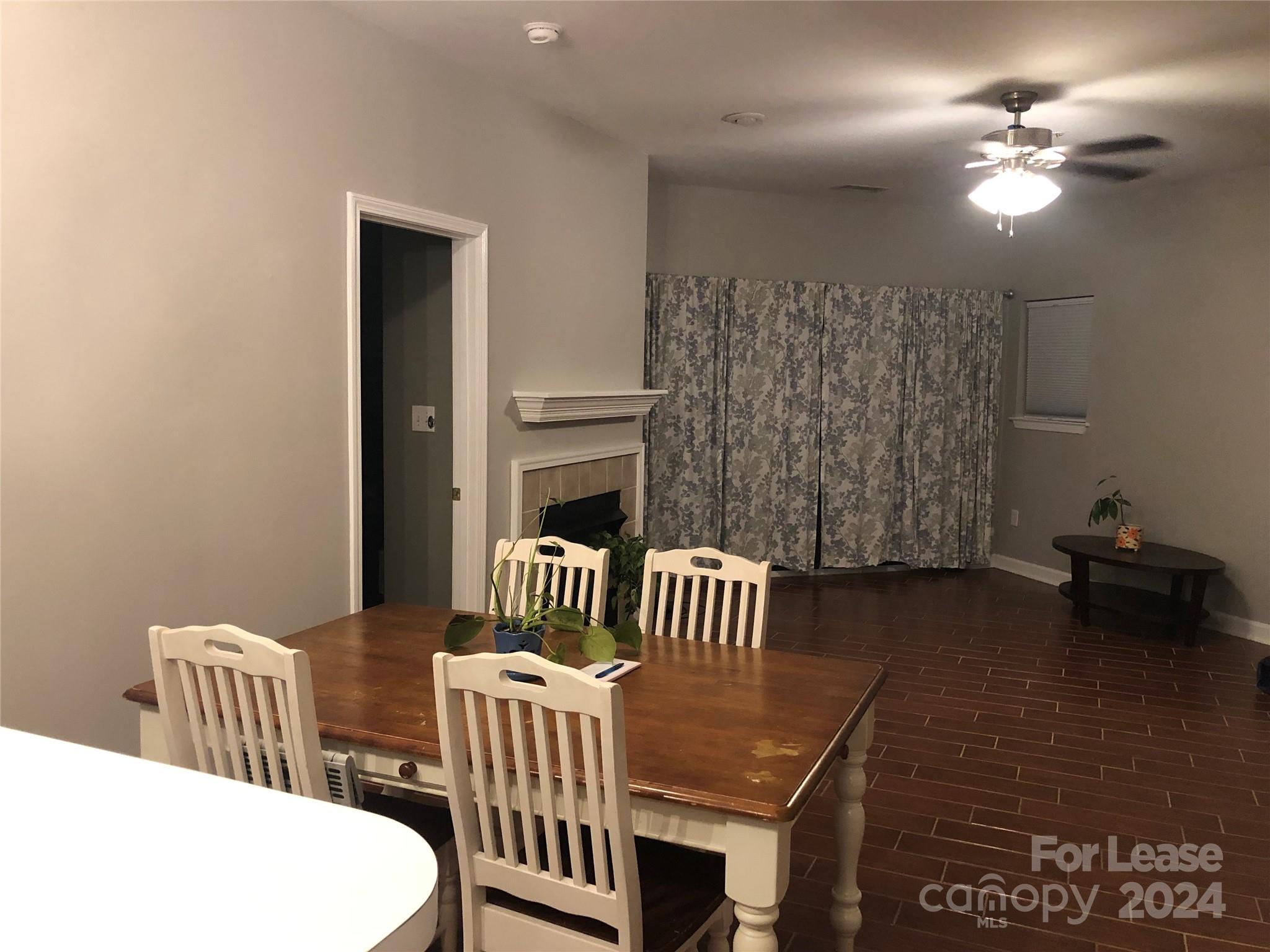 1328 Torrence Circle Davidson, NC 28036 - Photo 21 of 34 a bedroom with furniture and a fireplace