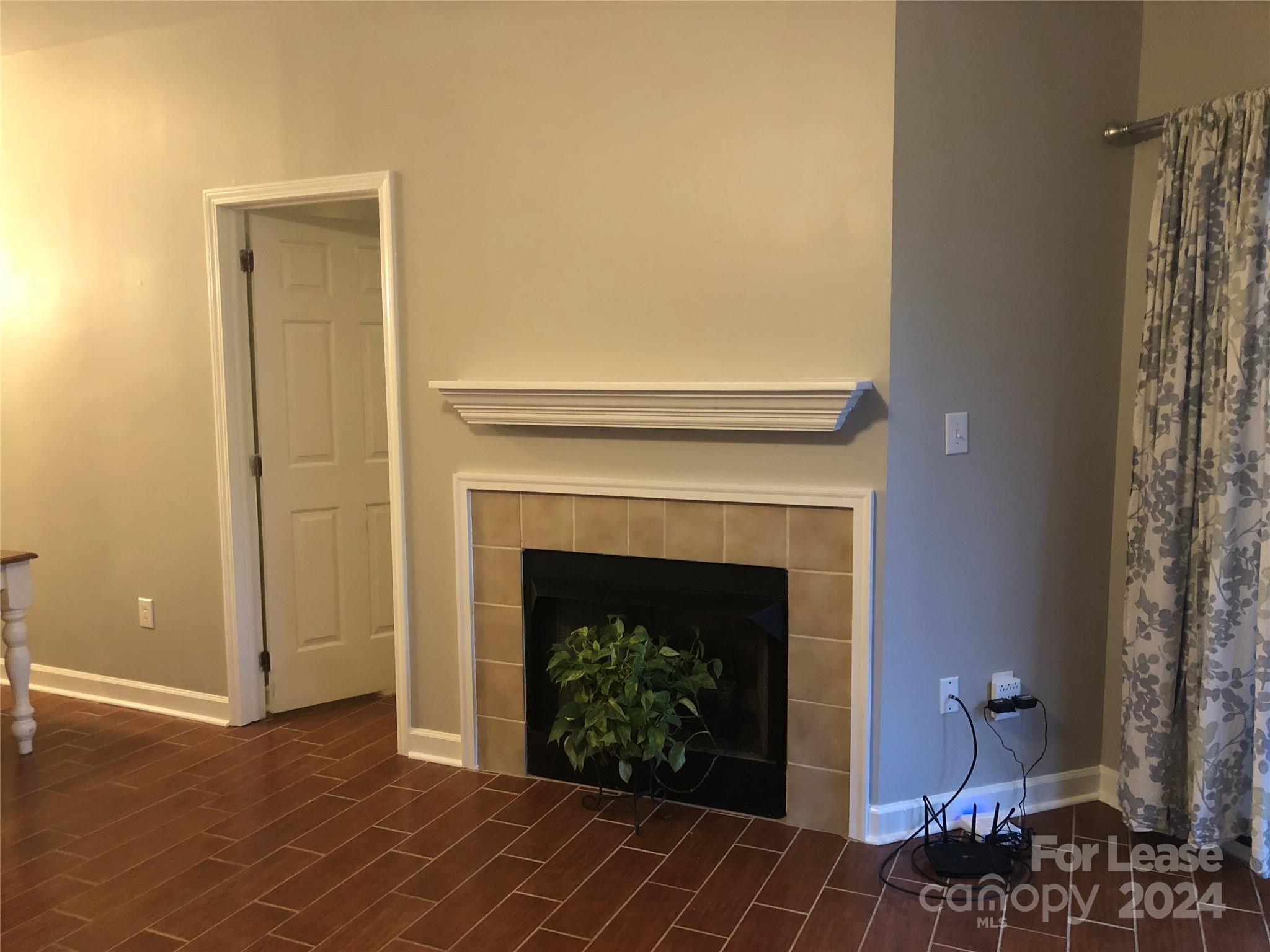 1328 Torrence Circle Davidson, NC 28036 - Photo 22 of 34 a living room with a fireplace