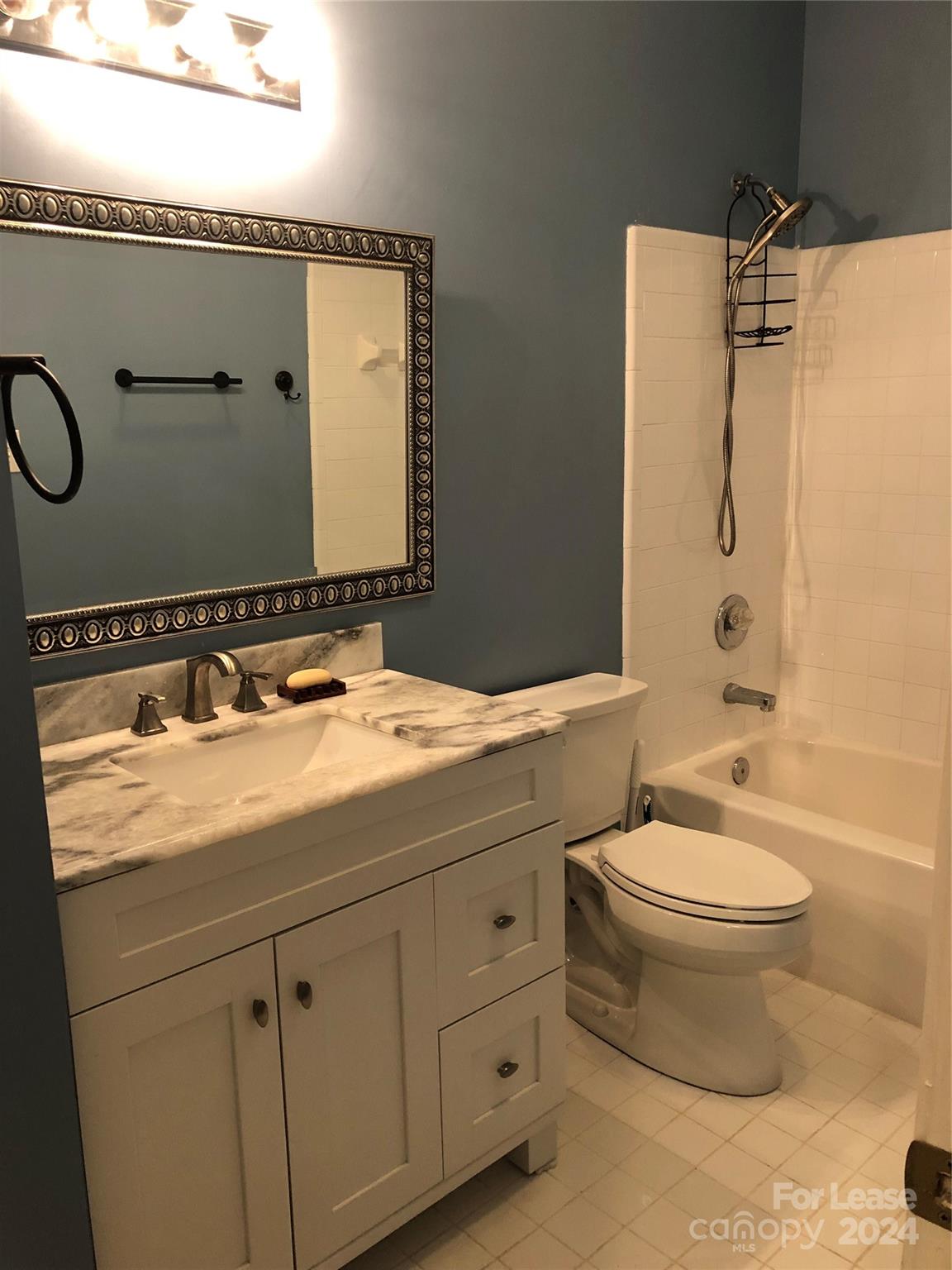 1328 Torrence Circle Davidson, NC 28036 - Photo 30 of 34 a bathroom with a sink and a mirror