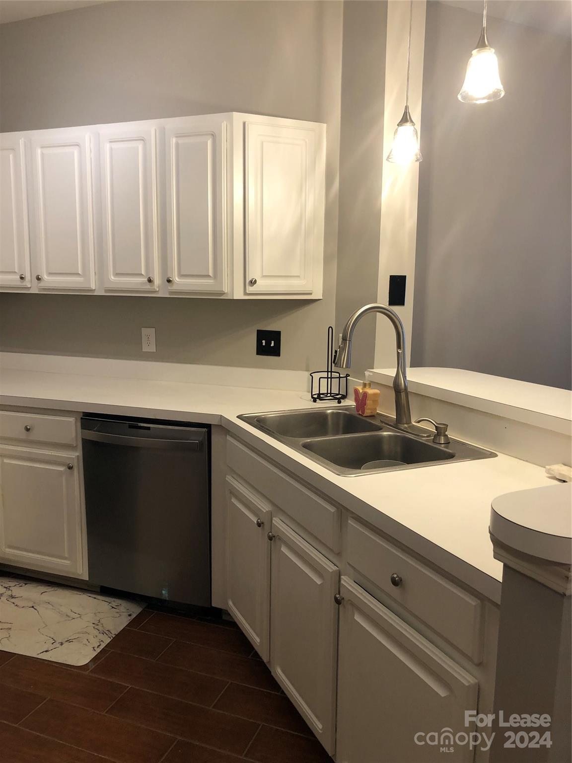 1328 Torrence Circle Davidson, NC 28036 - Photo 10 of 34 a kitchen with a sink and cabinets