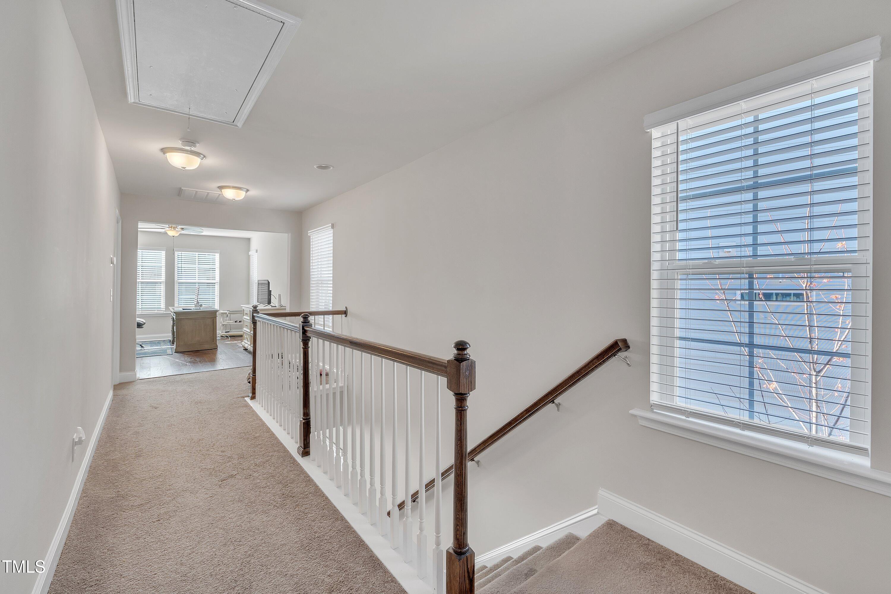 640 Newlyn Drive Raleigh, NC 27606 - Photo 22 of 44 a view of a hallway with windows