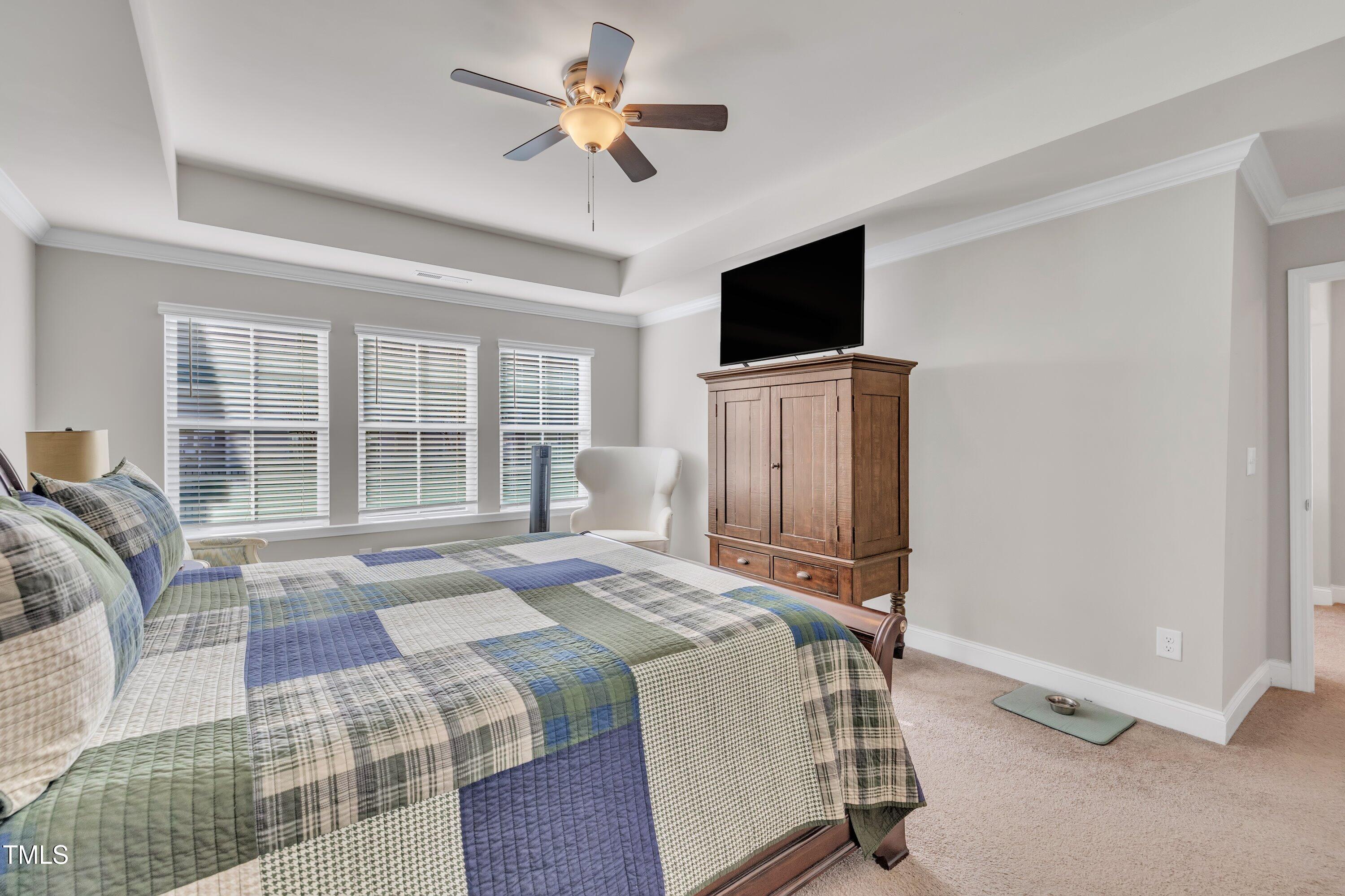 640 Newlyn Drive Raleigh, NC 27606 - Photo 25 of 44 a bedroom with a bed tv and a window