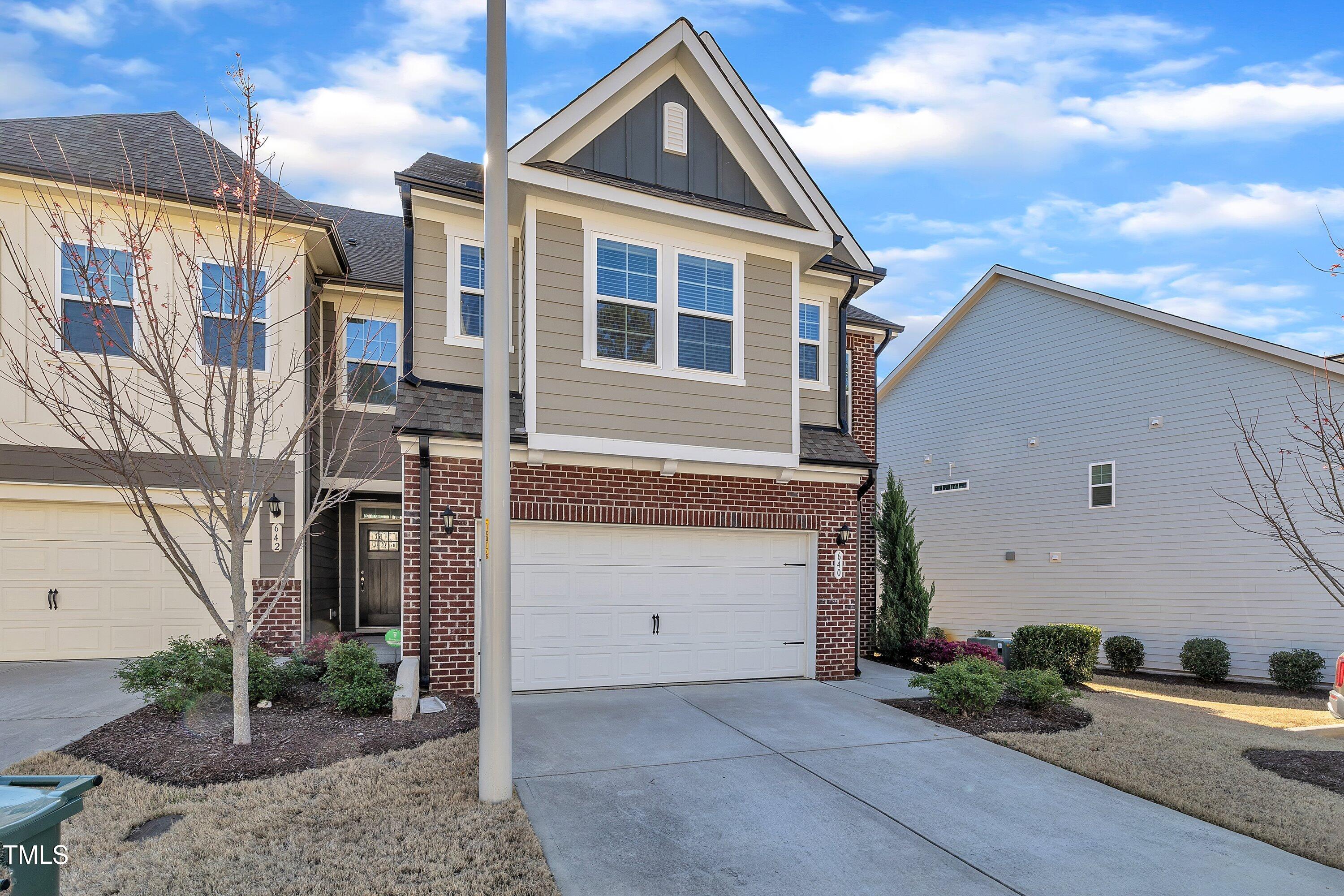 640 Newlyn Drive Raleigh, NC 27606 - Photo 2 of 44 a front view of a house with garden