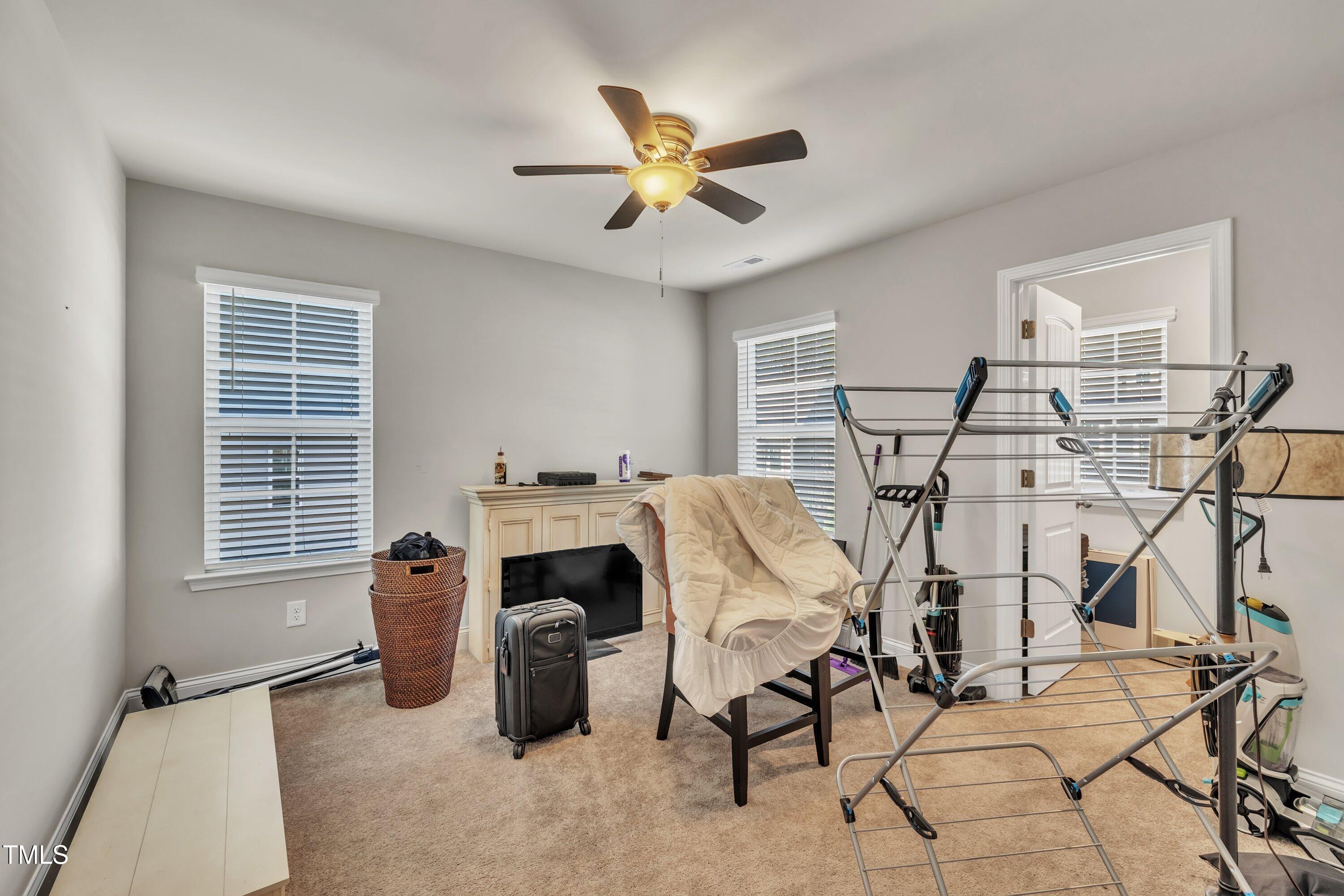 640 Newlyn Drive Raleigh, NC 27606 - Photo 35 of 44 a work room with furniture and a window