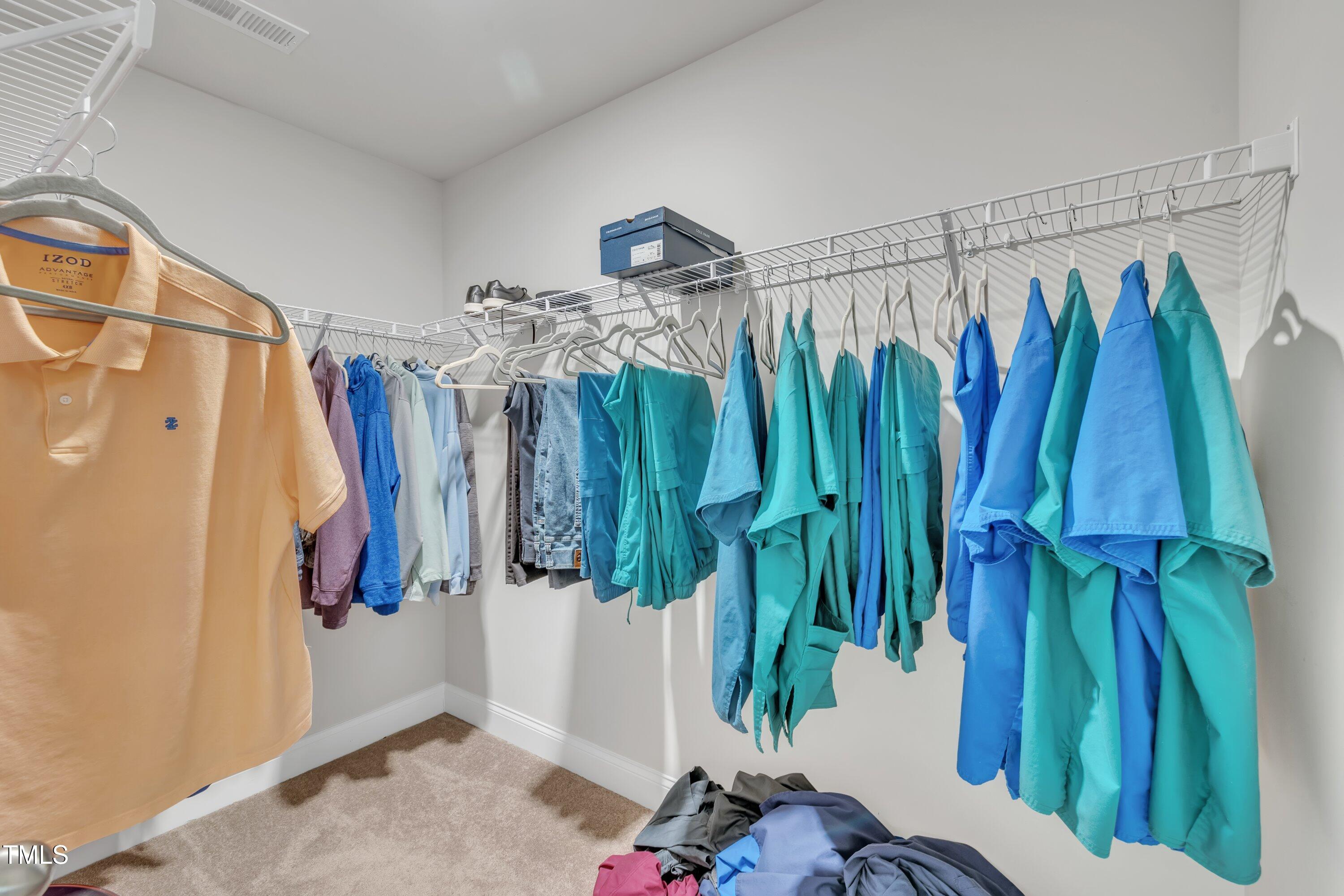 640 Newlyn Drive Raleigh, NC 27606 - Photo 36 of 44 a view of walk in closet with clothes