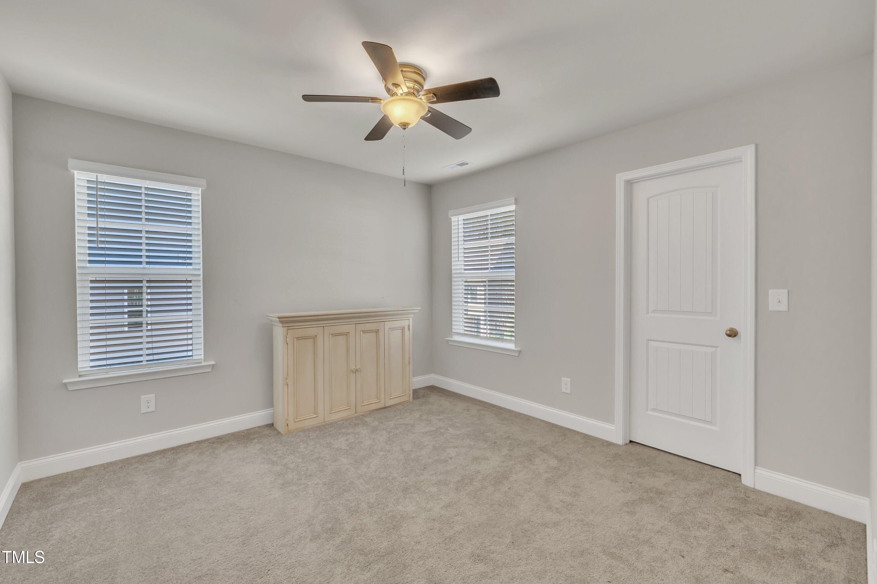 640 Newlyn Drive Raleigh, NC 27606 - Photo 38 of 44 a view of an empty room with a window