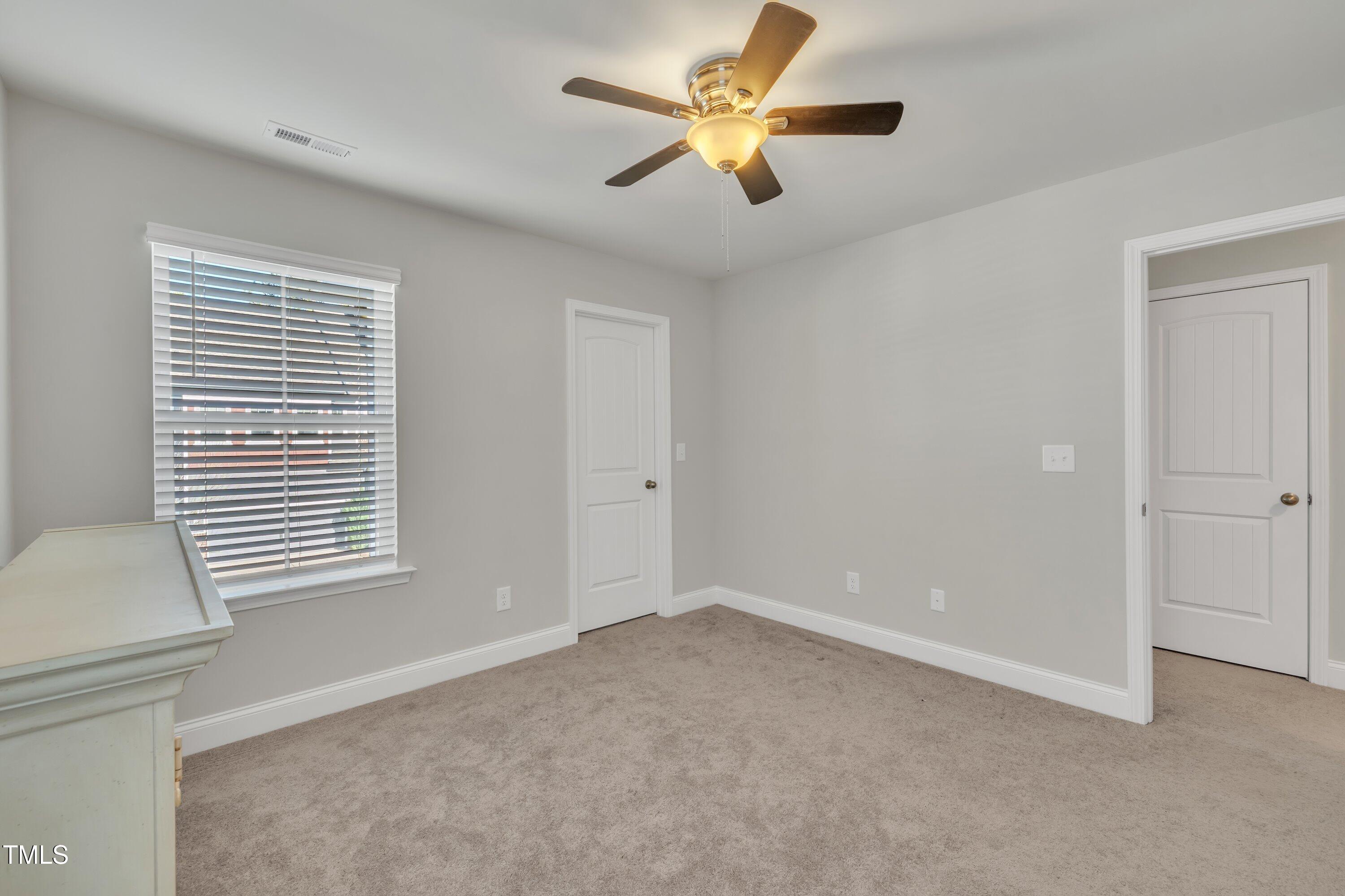 640 Newlyn Drive Raleigh, NC 27606 - Photo 39 of 44 a view of an empty room with a window