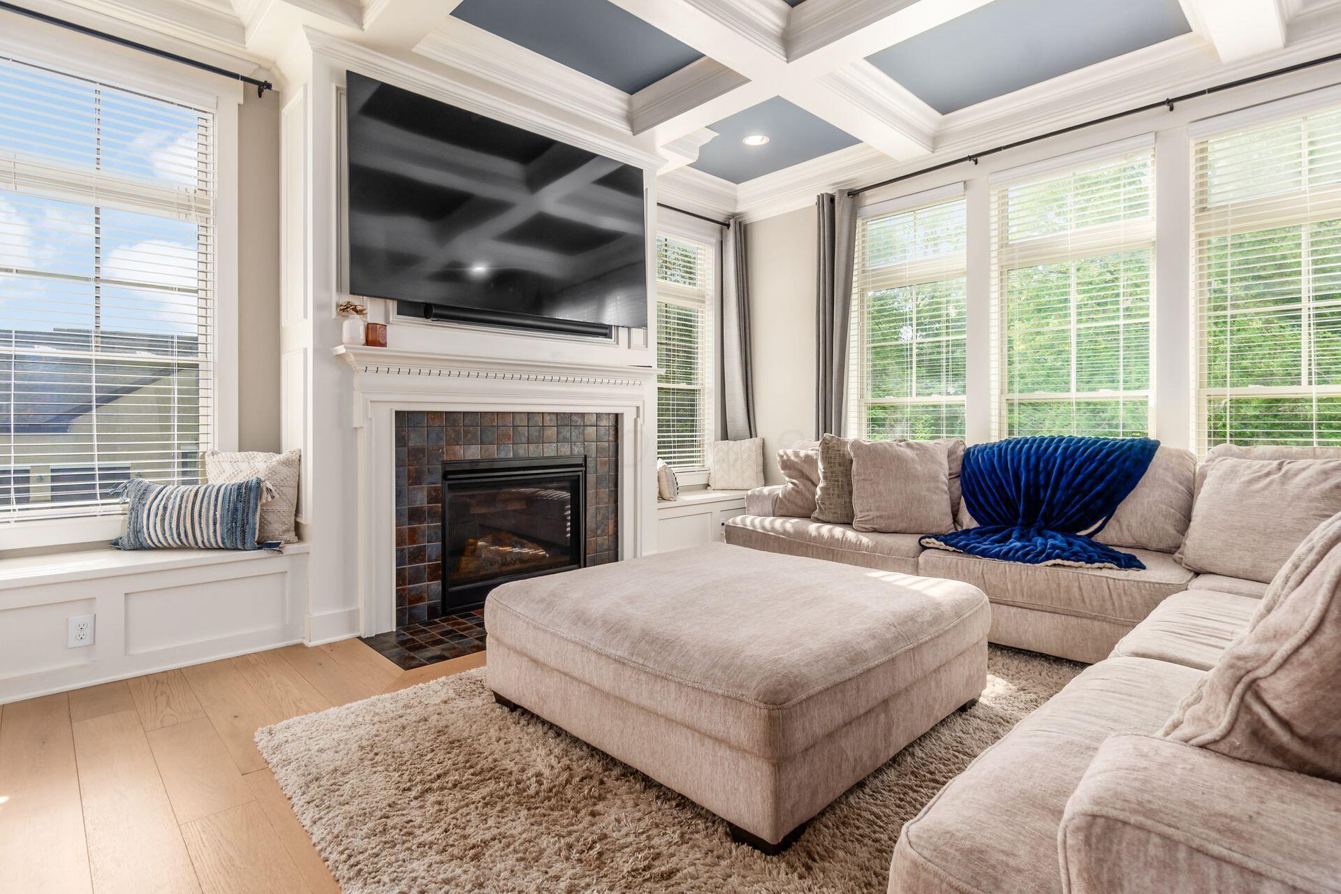 1002 Rambling Brook Way Delaware, OH 43015 - Photo 13 of 104 Spacious Great Room with coffered ceiling, window benches and gas fireplace