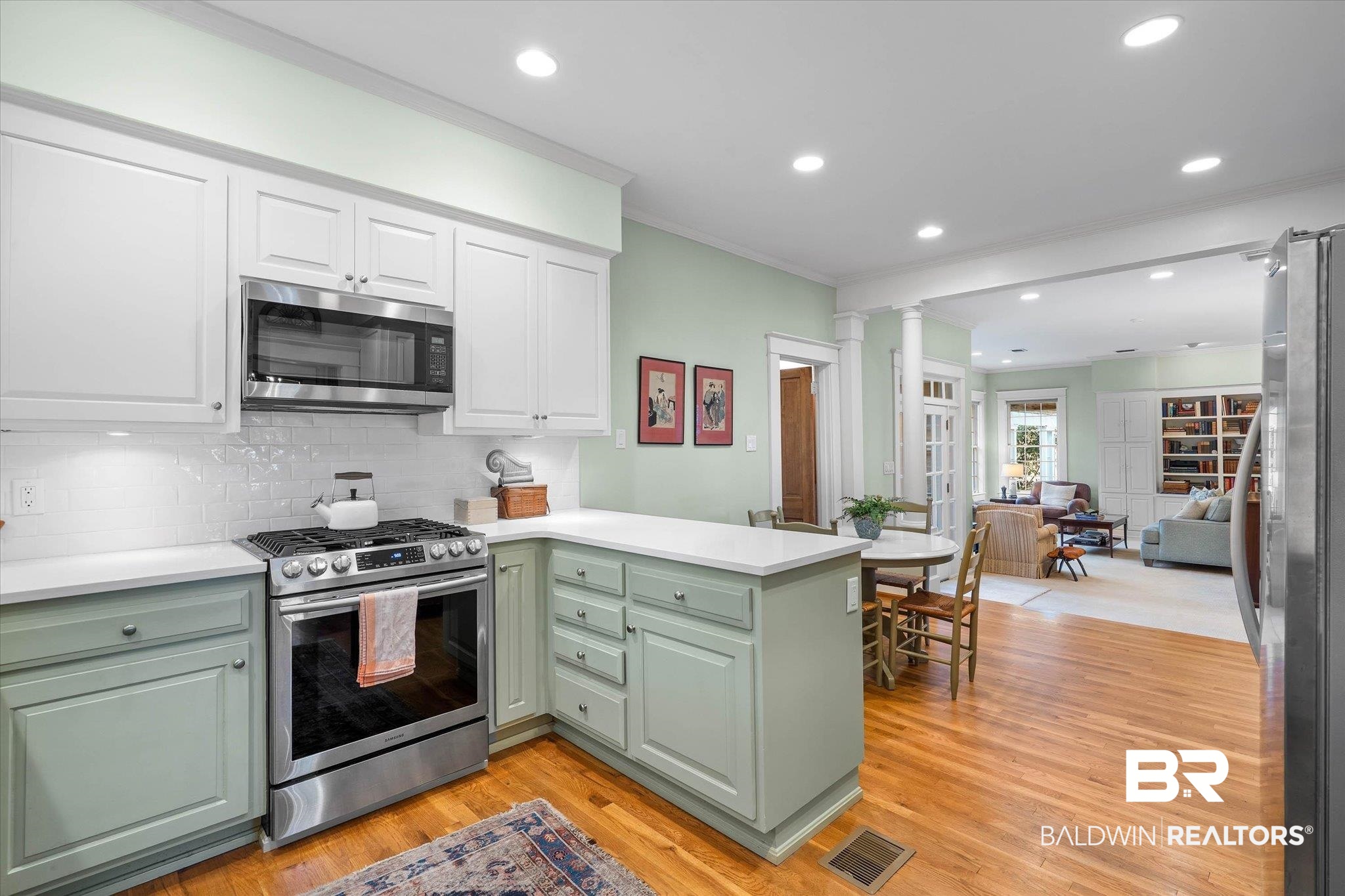 2 Westgate Road Mobile, AL 36608 - Photo 60 of 63 Dual tone kitchen with stainless steel appliances, crown molding, recessed lighting, open floor plan, and dual tone cabinets