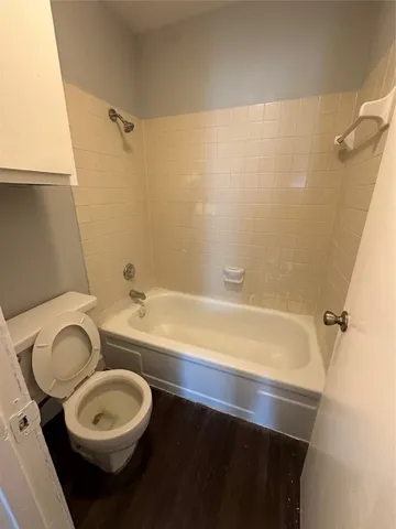 a bathroom with a sink a toilet and bathtub