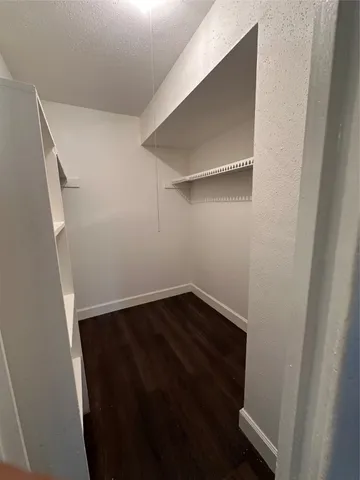 a view of an empty walk in closet