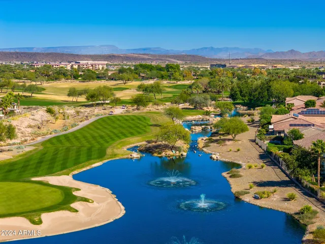 a view of a swimming pool with an outdoor space and seating area