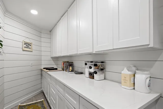 a kitchen with a sink and cabinets