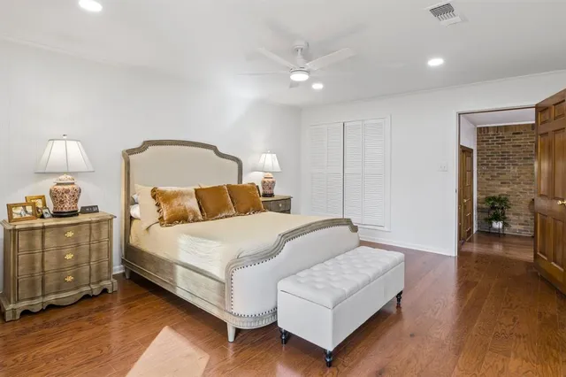 a bedroom with a bed and a lamp