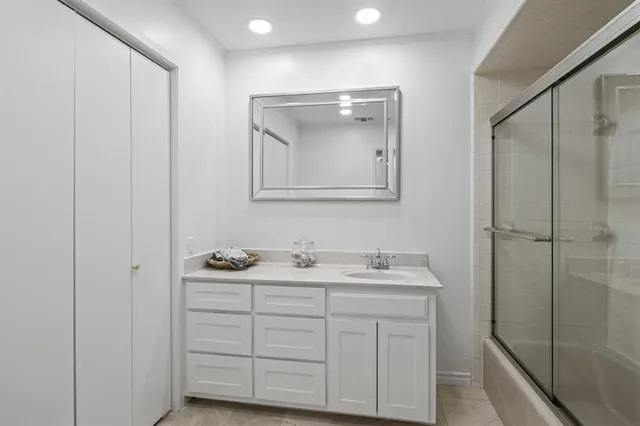 a bathroom with a sink and mirror