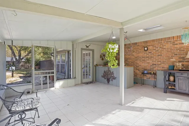 a view of a yard with large trees