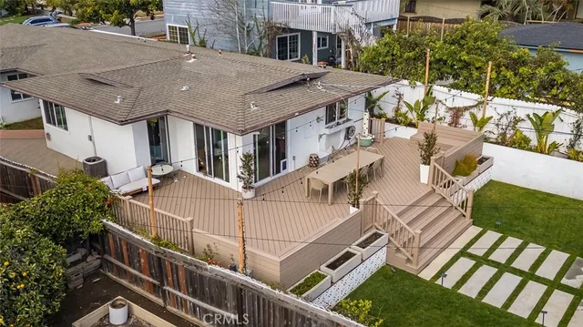 a aerial view of a house with a yard