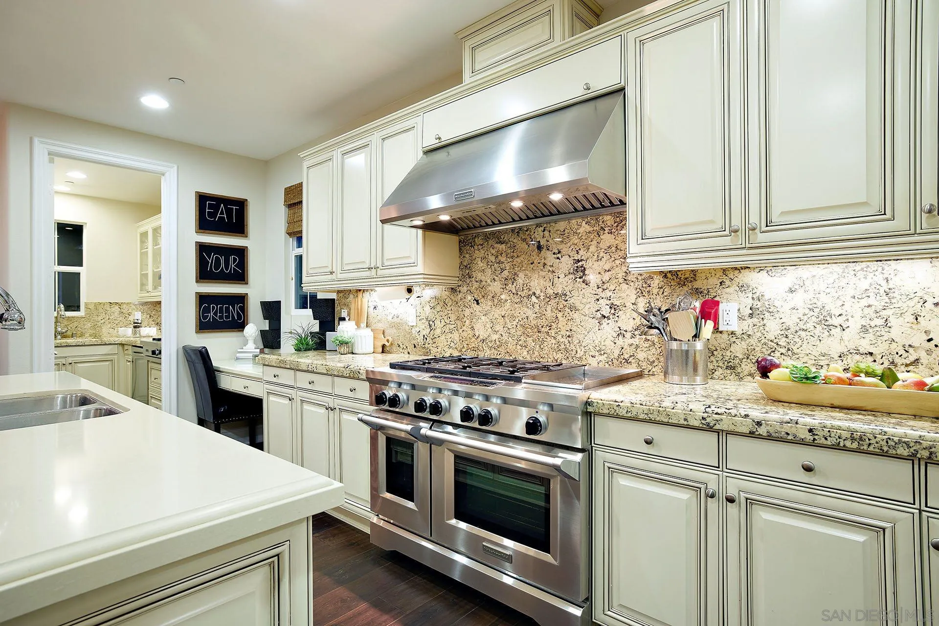 17778 Ralphs Ranch Road San Diego, CA 92127 - Photo 16 of 48 a kitchen with stainless steel appliances a stove sink and cabinets