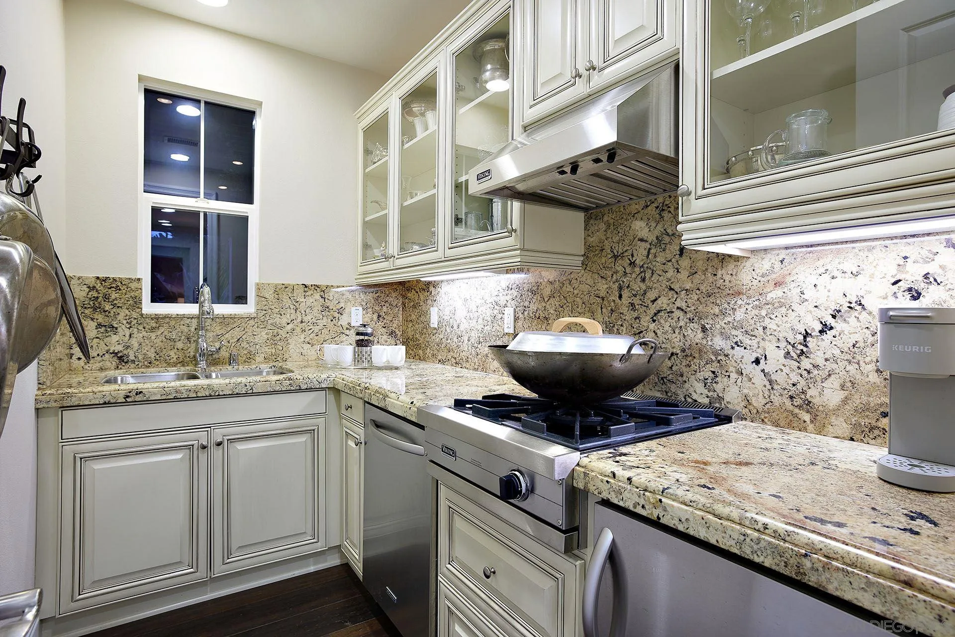 17778 Ralphs Ranch Road San Diego, CA 92127 - Photo 18 of 48 a view of a kitchen with a sink and a stove