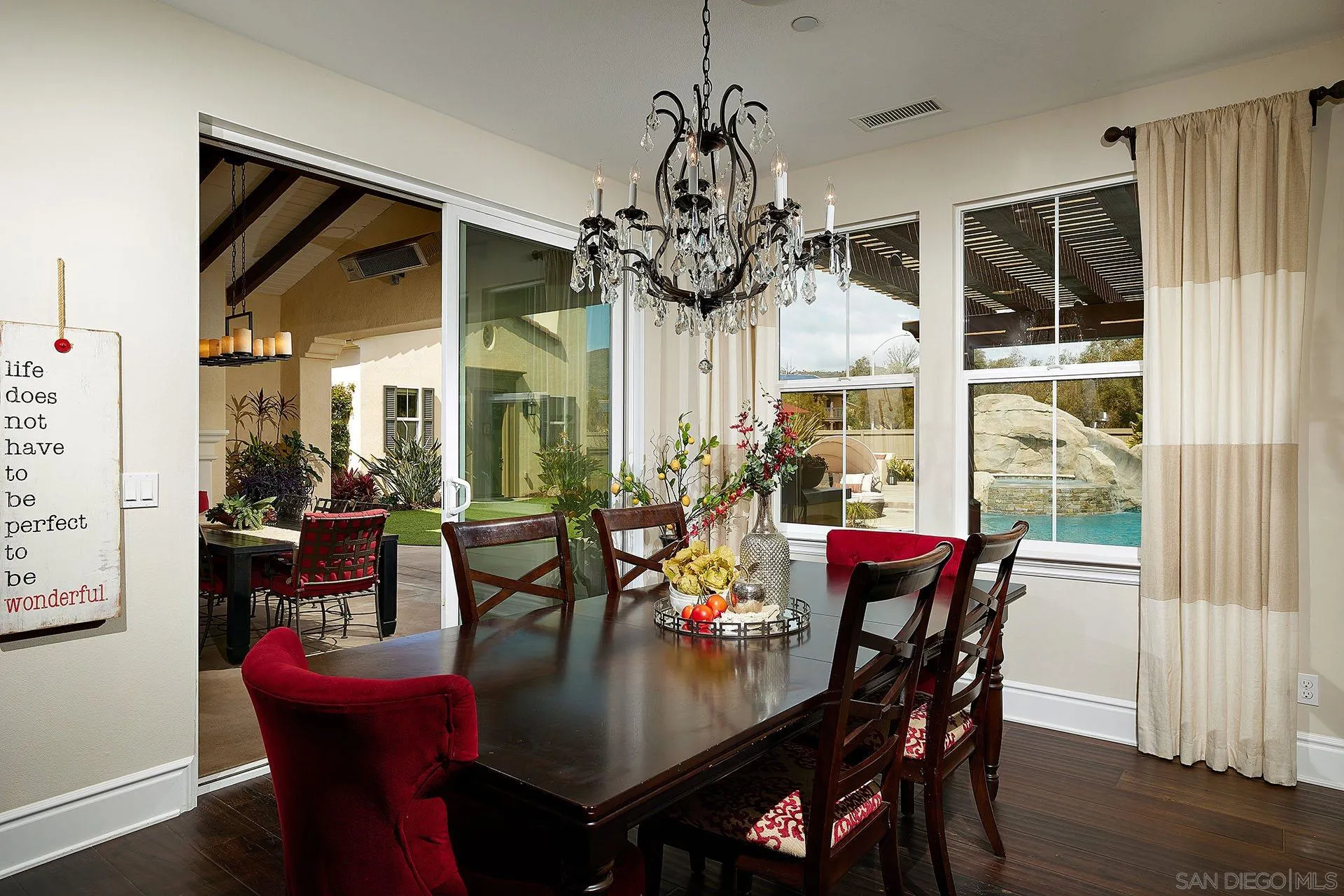 17778 Ralphs Ranch Road San Diego, CA 92127 - Photo 26 of 48 a view of a dining room with furniture window and wooden floor