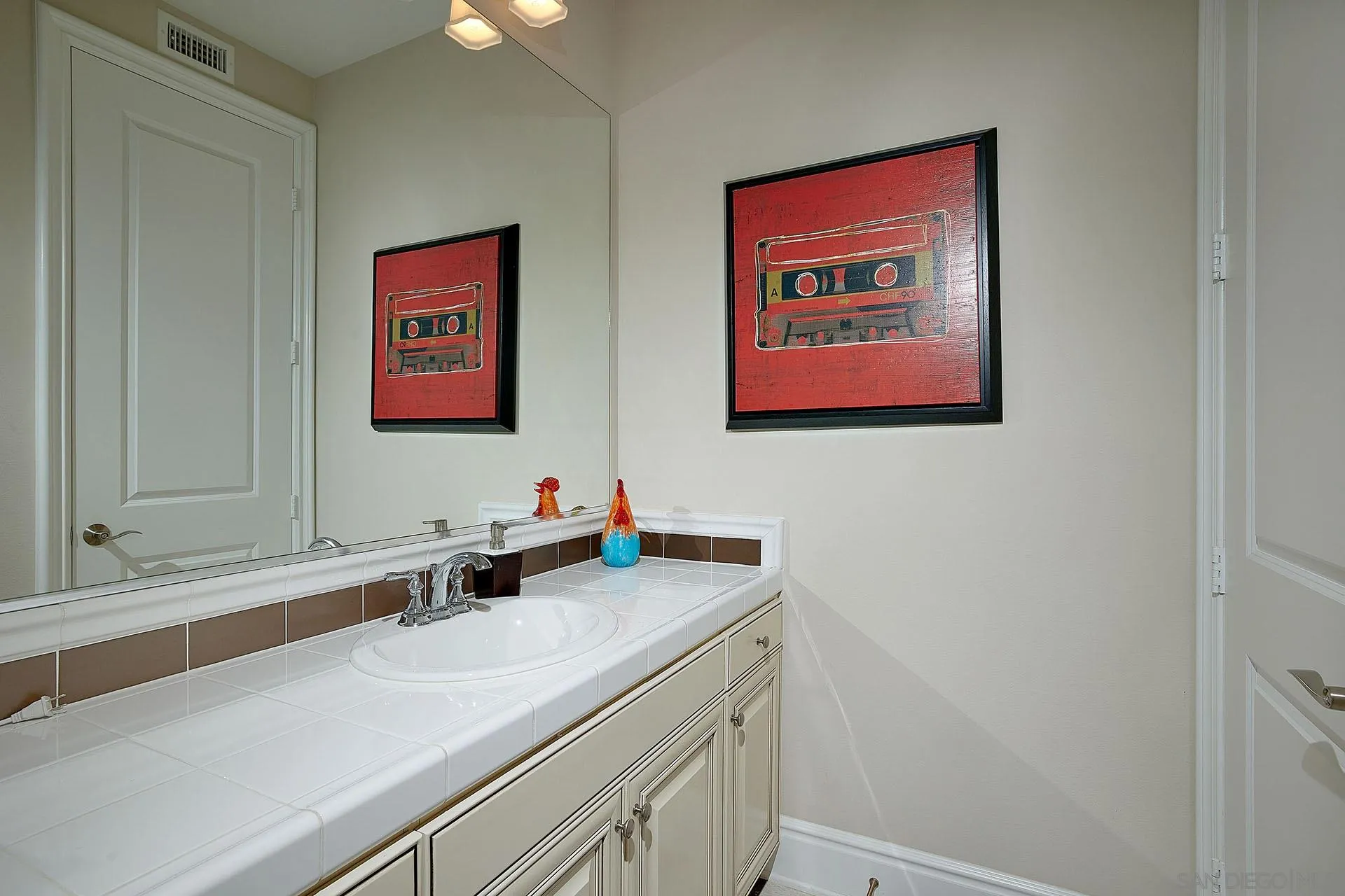 17778 Ralphs Ranch Road San Diego, CA 92127 - Photo 34 of 48 a bathroom with a sink and a mirror